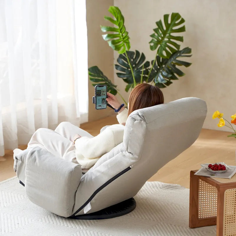 Fauteuil inclinable pivotant gris avec support de téléphone, appui-tête réglable
