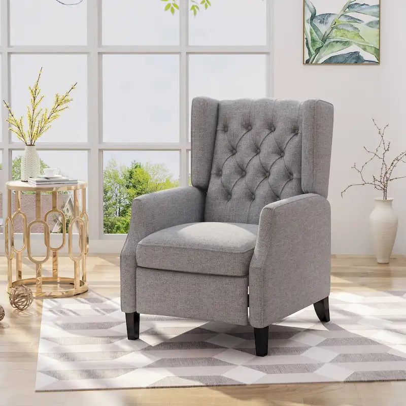 Fauteuil inclinable gris en tissu de style Mid-Century avec oreilles, mécanisme à poussoir, repose-pieds et dossier capitonné.
