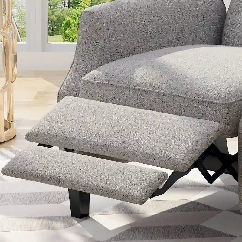 Fauteuil inclinable gris en tissu de style Mid-Century avec oreilles, mécanisme à poussoir, repose-pieds et dossier capitonné.